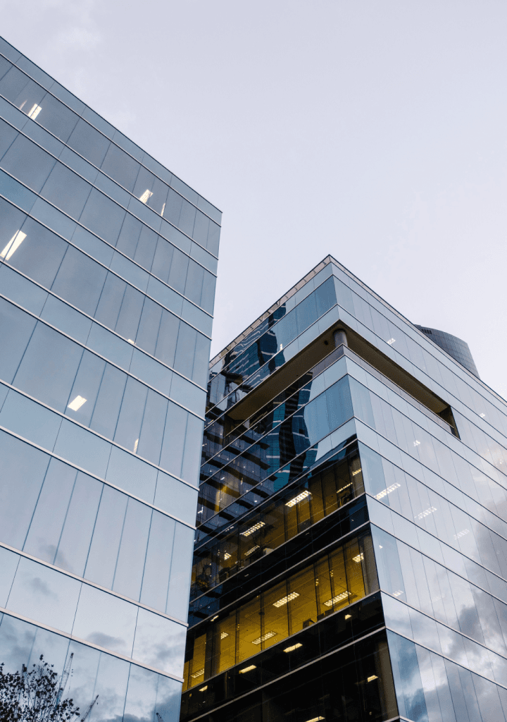Glass office building with cityscape background